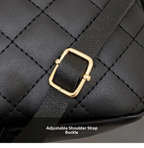 Detail of black quilted leather bag with an adjustable gold metal shoulder strap buckle