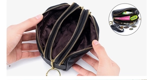 Three-layer black pebble grain leather coin purse with gold zippers and floral lining