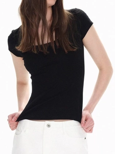Slim fit black U-neck short sleeve T-shirt for women styled with white trousers