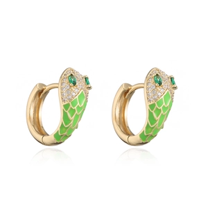 Detailed close-up of snake hoop earrings with green enamel scales and micro-pave crystals