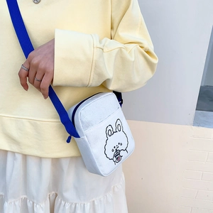Cute white canvas crossbody bag with cartoon bunny and blue adjustable shoulder strap