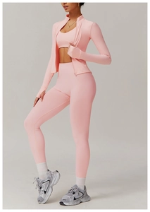 Detailed view of pink seamless yoga set including zip jacket, sports bra and high-waist pants
