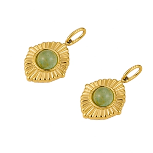 Detailed close-up of golden sunburst pendants with inlaid green natural stones