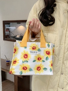 Minimalist canvas lunch bag with yellow sunflower patterns and stylish wide top handles