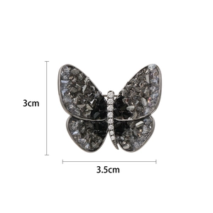 Elegant crystal butterfly brooch with dark grey stones and white rhinestones, size 3x3.5cm