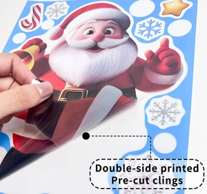 Detail showing double-sided pre-cut Christmas window clings with Santa and snowflake motifs