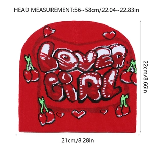 Detail view of red beanie showing Lover Girl text and cherry graphics with dimensions