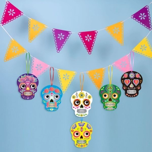 Detail of Day of the Dead banner with colorful sugar skulls and floral cutout pennants