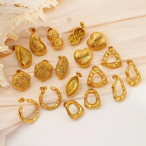 Golden textured geometric earrings set with hammered finish on soft beige fabric