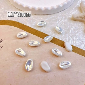 Detailed macro view of 11x6mm irregular baroque pearl beads for vintage nail art decor