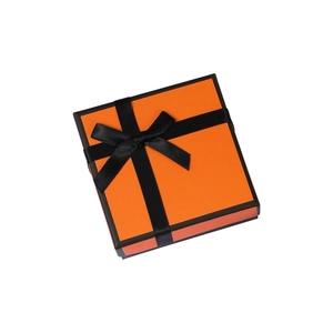 Elegant orange jewelry gift box with black borders and a decorative black ribbon bow