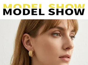 Chunky gold hoop earrings with vintage woven texture on model for stylish look