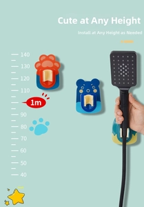 Detail view of adjustable wall-mount shower head bracket with cute cartoon animal designs