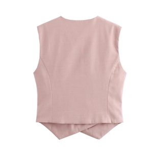 Detail view of pink sleeveless vest jacket back with smooth formal suit fabric texture