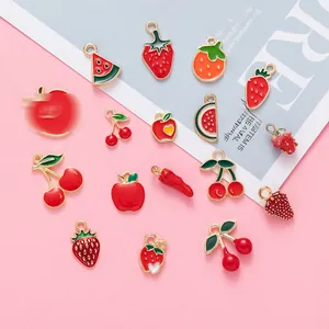 Macro detail of various colorful fruit alloy charms with gold plating for DIY jewelry