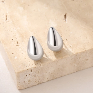 Polished S925 sterling silver teardrop stud earrings on minimalist stone base