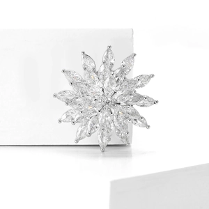 Detailed view of silver snowflake brooch featuring marquise-cut cubic zirconia crystals