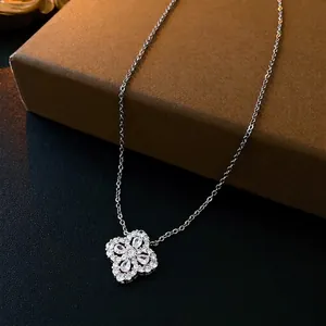 Silver four-leaf clover zircon pendant necklace on a jewelry box with detailed pavé setting