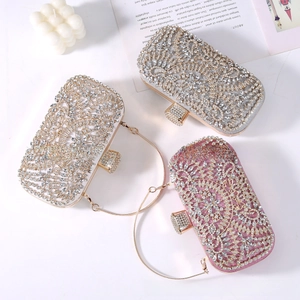 Detailed view of luxury evening clutch bags with sparkling rhinestones in three elegant colors