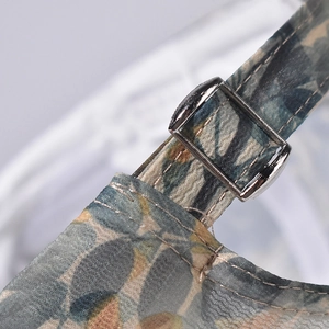 Detail view of baseball cap with leaf print and silver adjustable metal buckle