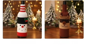 Detail of knitted snowman and elk wine bottle covers for festive Christmas table decor