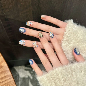 Handmade press-on nails with cute Egyptian cat art, glitter, and gold 3D charms