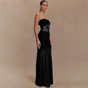 Detail of black strapless maxi dress with lace inserts and elegant ruched fabric