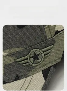 Detail of military star embroidery and durable camo canvas texture on tactical flat cap