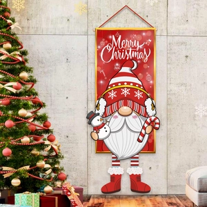 Merry Christmas banner with festive Gnome and snowman hanging on a classic gray wall