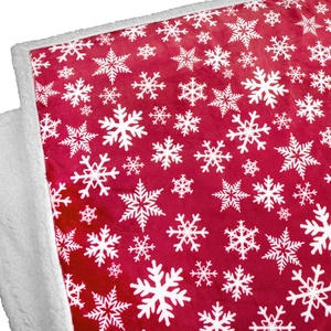 Christmas sherpa fleece blanket with red snowflake pattern and white faux lamb wool lining