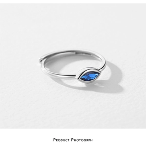 Macro detail of S925 sterling silver evil eye ring with marquise blue zircon stone