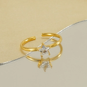 Adjustable gold star ring featuring a brilliant zircon stone on a sleek metallic band