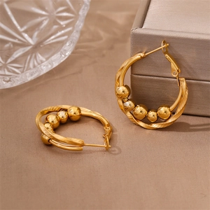 Twisted stainless steel hoop earrings with movable beads in a gold polished finish