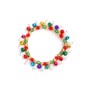 Close-up of colorful Christmas bells bracelet with pearls and festive faceted beads