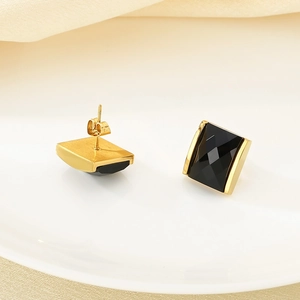Elegant square black glass stud earrings with 18K gold plating on a white background