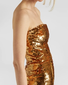 Robe bustier moulante à paillettes dorées avec fente irrégulière et texture scintillante