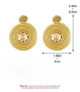 Detailed view of French vintage gold wire swirl earrings with brown gemstone 6.2cm x 5cm