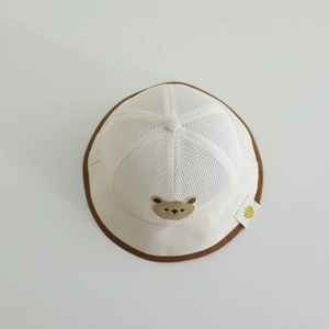Detail of baby sun hat with breathable mesh crown and cute brown bear embroidery