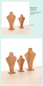 Close-up of wooden bust necklace display stands in different sizes for jewelry exhibition