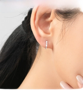 Detailed view of S925 silver ear hoop with white enamel coating and zircon stones