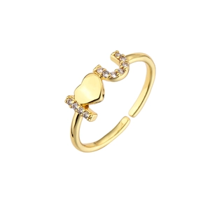 Close-up of gold-plated LOVE ring with micro-paved cubic zirconia and adjustable band