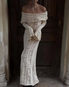 Detail of elegant off-shoulder crochet knit dress with long sleeves in cream white color