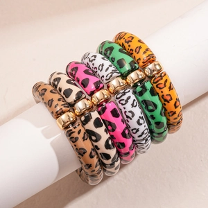 Detail showing colorful leopard print acrylic bamboo beads with gold metal spacers