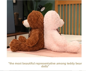 Close-up of two plush teddy bears with plaid bowties in a cozy bedroom setting
