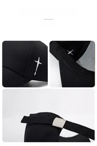 Detail of cross embroidery, neat inner seams and metal buckle on black baseball cap