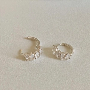 Elegant 925 sterling silver hoop earrings with oval-cut clear cubic zirconia stones