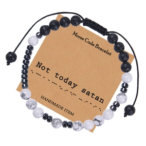 Detail of Morse code bracelet with natural white turquoise on a kraft paper gift card