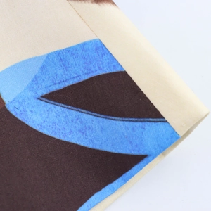 Elegant A-line floral skirt with blue and brown abstract geometric patterns on beige fabric
