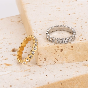 Minimalist stainless steel eternity rings with inlaid crystals in gold and silver
