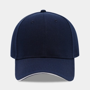 Classic navy blue six-panel baseball cap with pre-curved brim and white sandwich piping